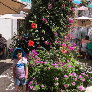 Kid and flowers
